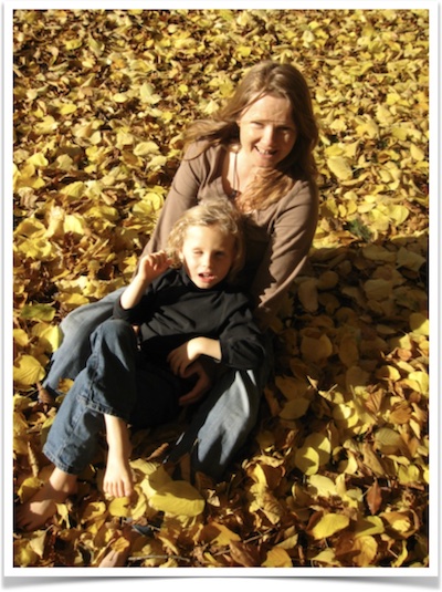 Nicole and Jonah playing in leaves